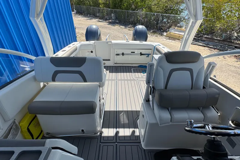 Slide: The Image of 2020 World Cat 28 DCX boat interior with seating and steering wheel. - 5