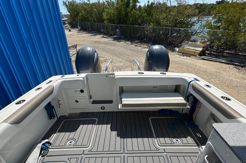 Slide: The Image of 2020 World Cat 28 DCX boat deck with seating and twin engines. - 6