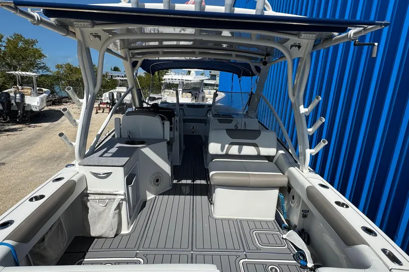 Slide: The Image of 2020 World Cat 28 DCX boat interior with seating and rod holders. - 7