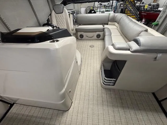 Slide: The Image of 2019 Harris Grand Mariner 250 interior with plush seating and modern helm. - 12