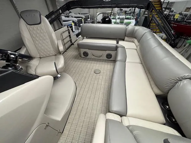 Slide: The Image of 2019 Harris Grand Mariner 250 boat interior with spacious seating and modern design. - 14