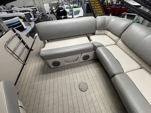 Slide: The Image of 2019 Harris Grand Mariner 250 interior with gray seating and carpeted flooring. - 16