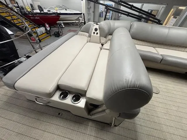 Slide: The Image of 2019 Harris Grand Mariner 250 boat interior with plush seating and cup holders. - 18