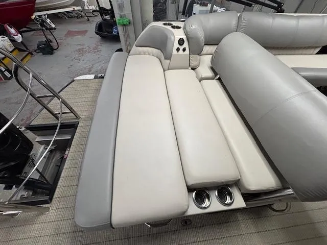 Slide: The Image of 2019 Harris Grand Mariner 250 boat interior with gray seating and cup holders. - 20