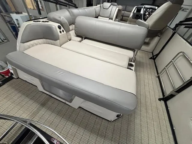 Slide: The Image of 2019 Harris Grand Mariner 250 interior with plush seating and modern dashboard. - 22