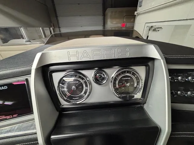 Slide: The Image of Dashboard of 2019 Harris Grand Mariner 250 boat with gauges and controls. - 32