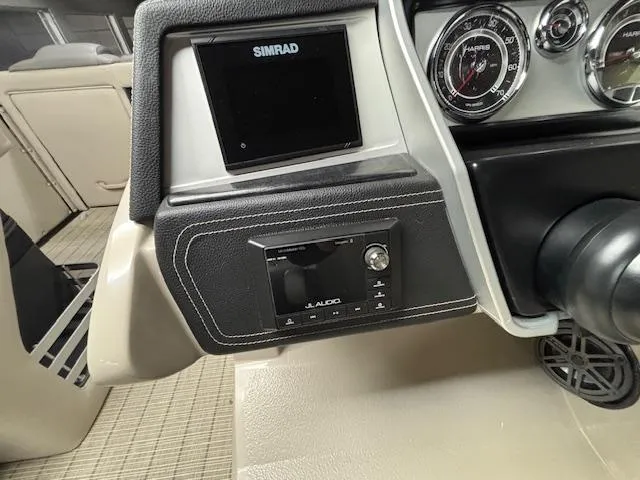 Slide: The Image of Dashboard of 2019 Harris Grand Mariner 250 with Simrad display and audio controls. - 33