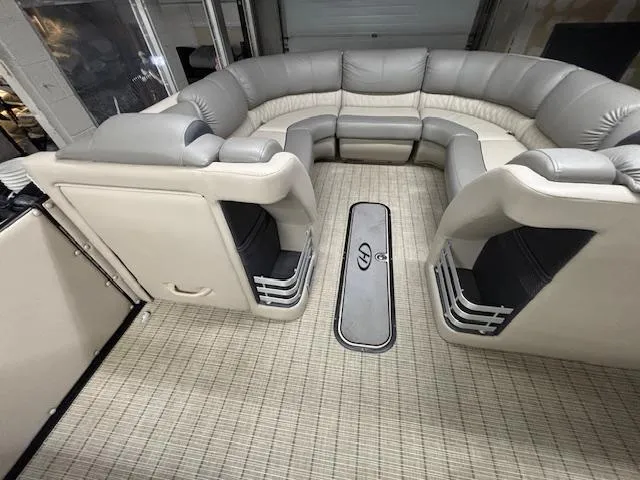 Slide: The Image of 2019 Harris Grand Mariner 250 interior with plush seating and carpeted flooring. - 35