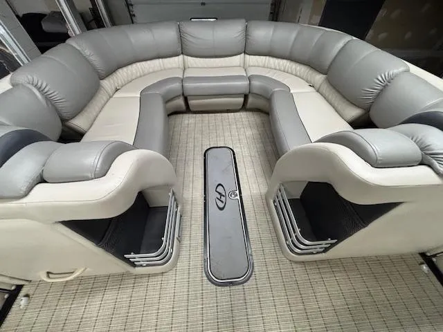 Slide: The Image of Luxurious seating on 2019 Harris Grand Mariner 250 pontoon boat, featuring plush gray upholstery. - 37
