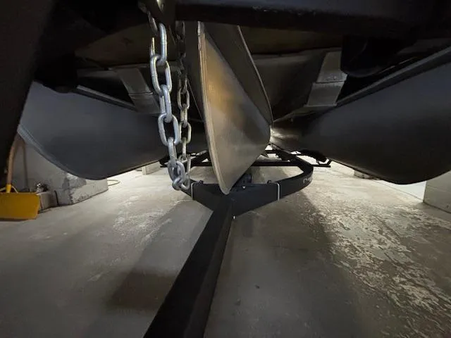 Slide: The Image of Underneath view of a 2019 Harris Grand Mariner 250 pontoon boat on a trailer. - 39