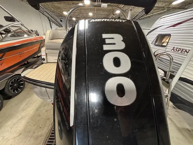 Slide: The Image of 2019 Harris Grand Mariner 250 with Mercury 300 outboard engine in a showroom. - 4