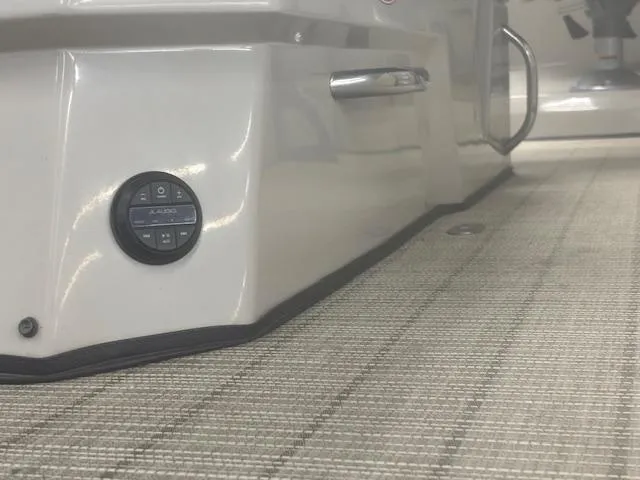 Slide: The Image of 2019 Harris Grand Mariner 250 boat interior with control panel and textured flooring. - 44