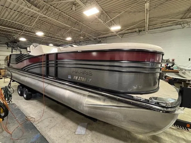 Slide: The Image of 2019 Harris Grand Mariner 250 pontoon boat in indoor storage facility. - 5