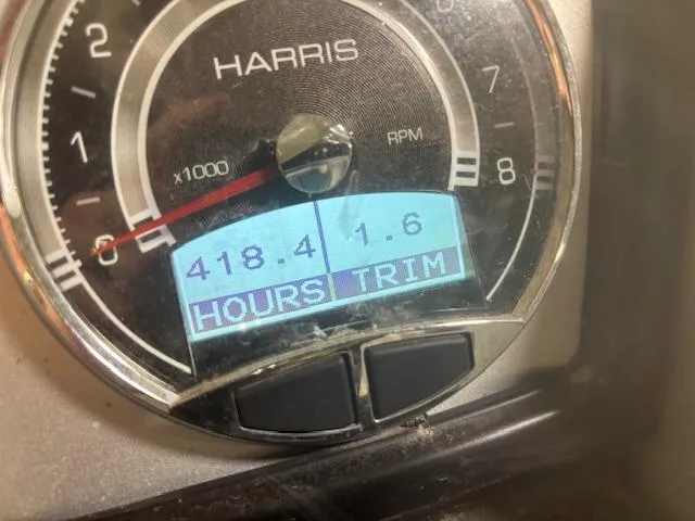 Slide: The Image of Close-up of 2019 Harris Grand Mariner 250 RPM gauge displaying 418.4 hours and 1.6 trim. - 7