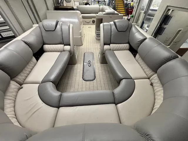 Slide: The Image of 2019 Harris Grand Mariner 250 interior with luxurious gray seating and spacious layout. - 8