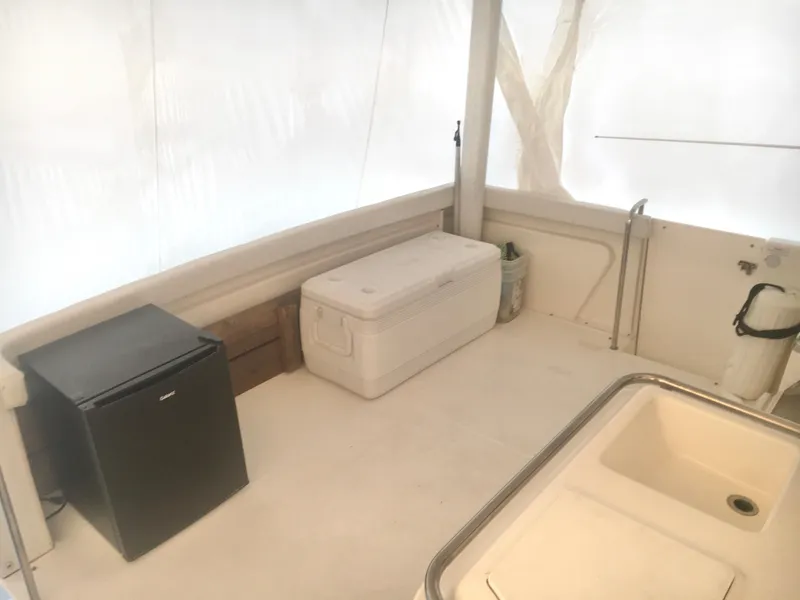 Slide: The Image of 1996 Silverton 372 Motor Yacht interior with fridge, cooler, and sink. - 10