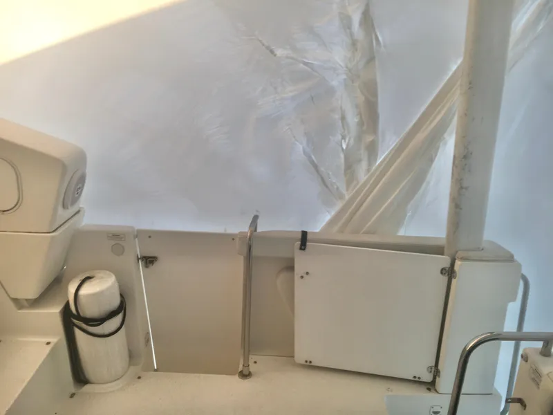 Slide: The Image of 1996 Silverton 372 Motor Yacht interior with white protective covering. - 13