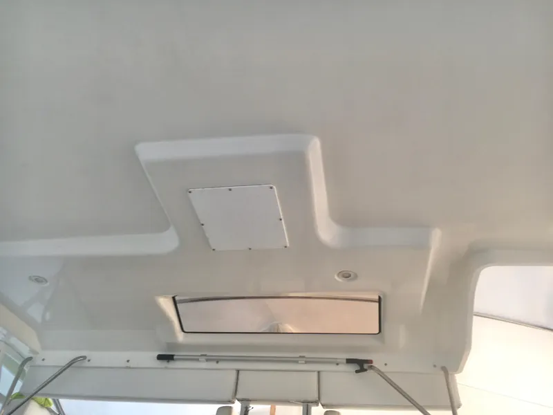 Slide: The Image of Ceiling view of 1996 Silverton 372 Motor Yacht interior with hatch and lighting. - 14