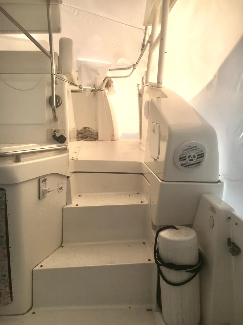Slide: The Image of 1996 Silverton 372 Motor Yacht interior stairs with white finish and built-in speaker. - 15