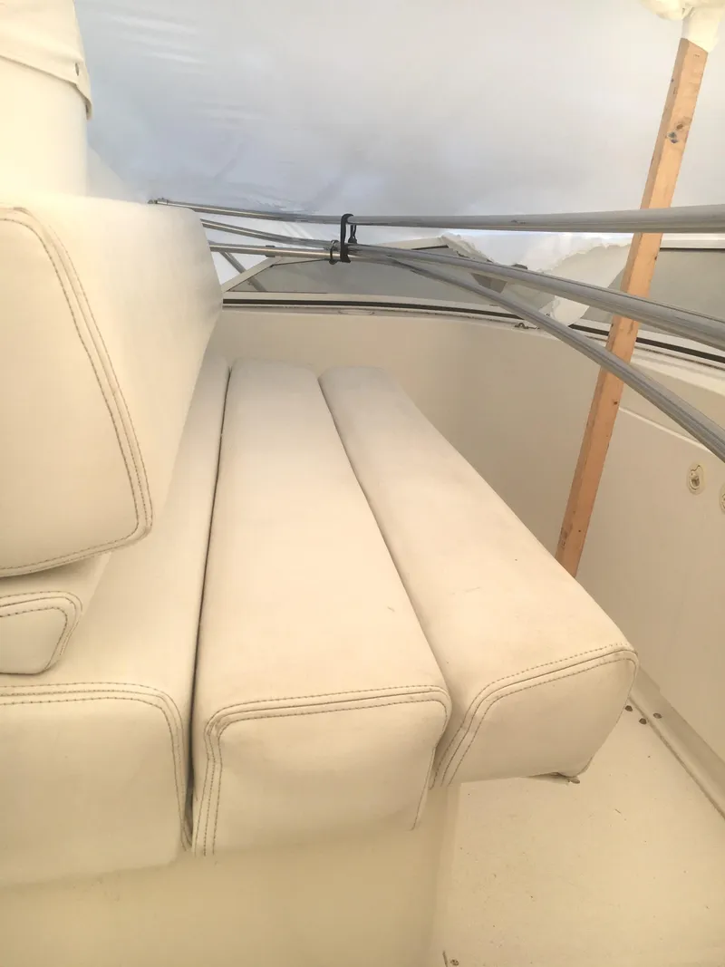 Slide: The Image of 1996 Silverton 372 Motor Yacht interior with white seating and metal framework. - 17