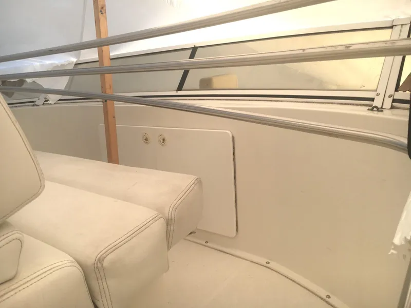 Slide: The Image of 1996 Silverton 372 Motor Yacht interior with beige seating and railing. - 18