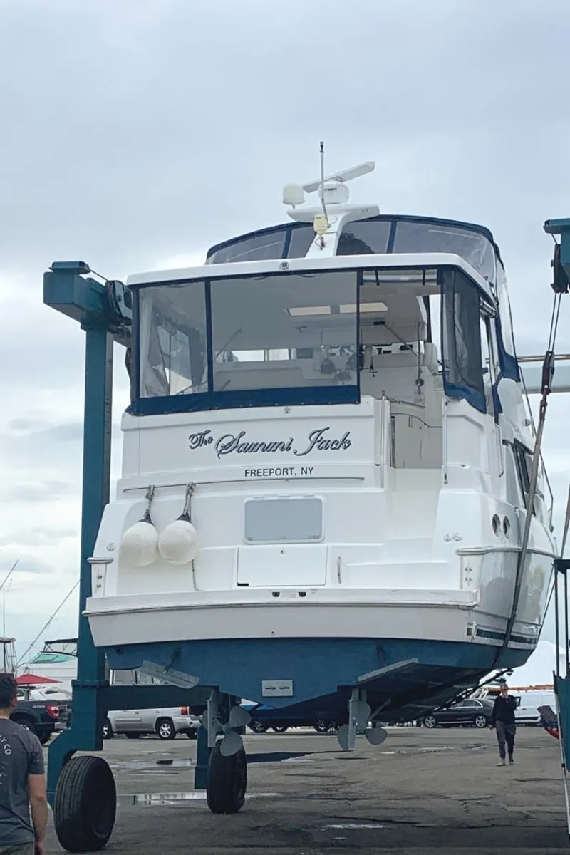 Slide: The Image of 1996 Silverton 372 Motor Yacht on lift at marina, Freeport, NY. - 2