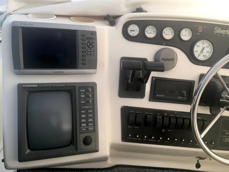 Slide: The Image of 1996 Silverton 372 Motor Yacht dashboard with navigation and control instruments. - 20