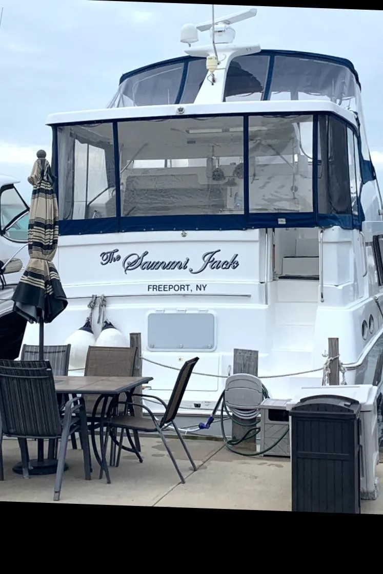 Slide: The Image of 1996 Silverton 372 Motor Yacht docked, named "The Samurai Jack," in Freeport, NY. - 3