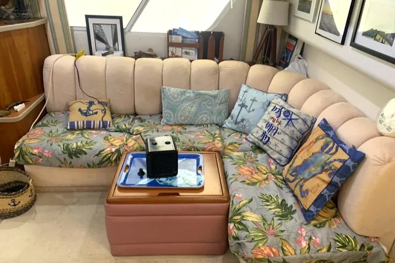 Slide: The Image of Cozy interior of 1996 Silverton 372 Motor Yacht with floral cushions and nautical-themed decor. - 33