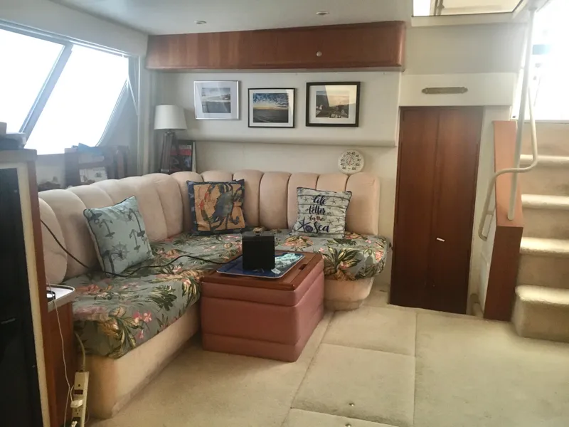 Slide: The Image of Interior of 1996 Silverton 372 Motor Yacht with cozy seating and decor. - 34