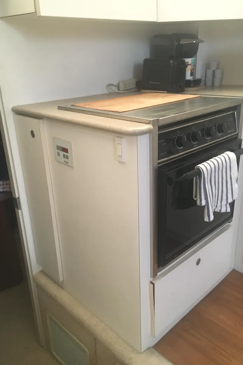 Slide: The Image of 1996 Silverton 372 Motor Yacht kitchen with stove and countertop. - 38