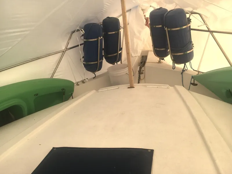 Slide: The Image of 1996 Silverton 372 Motor Yacht interior with blue and green fenders. - 4