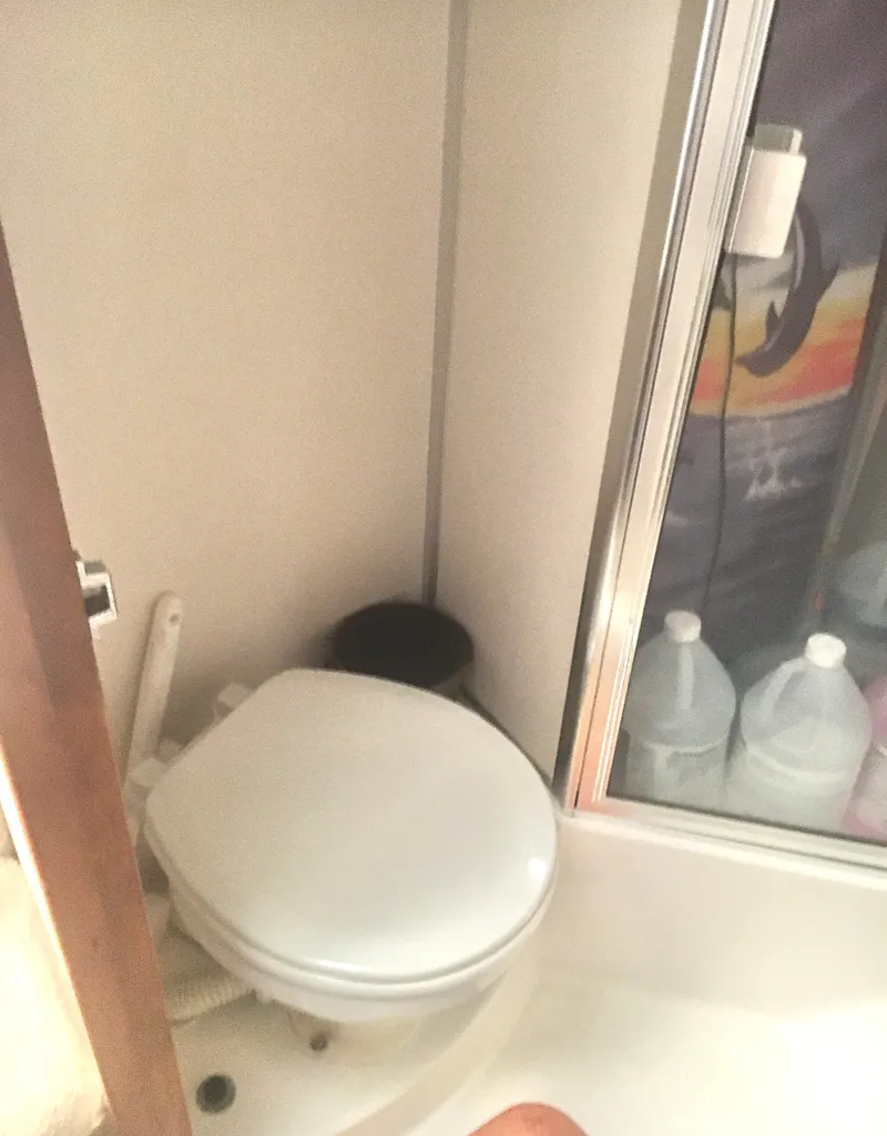 Slide: The Image of 1996 Silverton 372 Motor Yacht bathroom with toilet and shower area. - 40