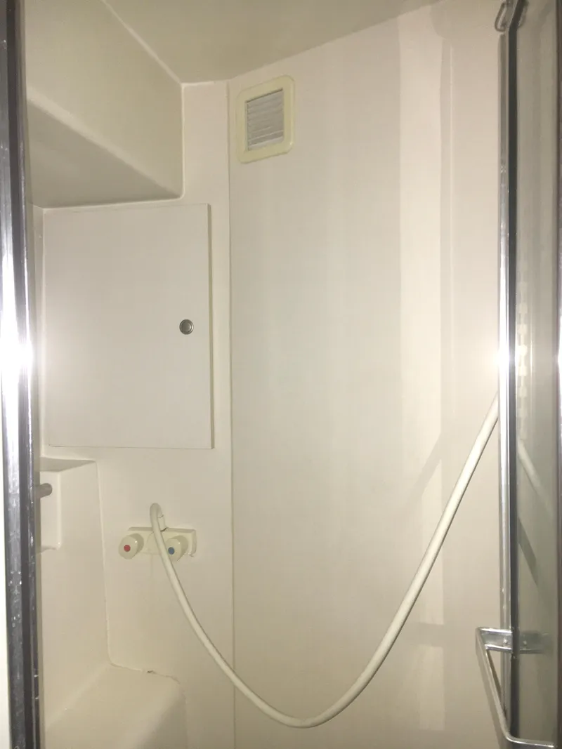 Slide: The Image of Shower area in a 1996 Silverton 372 Motor Yacht, featuring a sleek, minimalist design. - 41