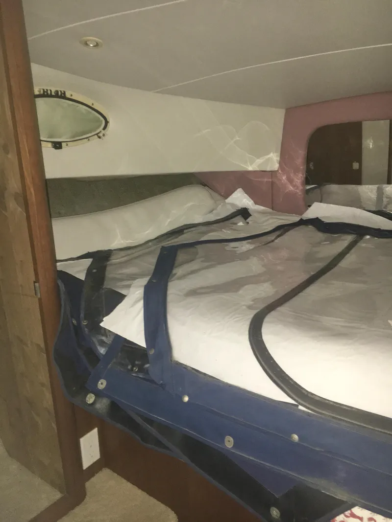 Slide: The Image of Interior cabin of 1996 Silverton 372 Motor Yacht with bed and porthole. - 43