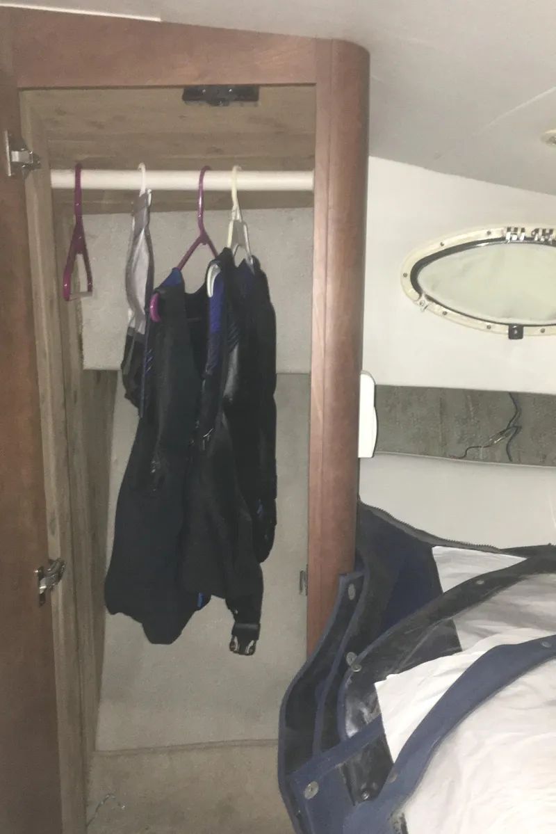 Slide: The Image of Interior of 1996 Silverton 372 Motor Yacht with closet and bed. - 44