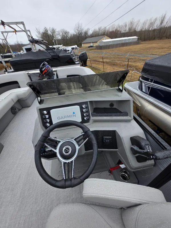 Slide: The Image of 2025 Qwest E-Class 22 XRE Cruise boat interior with Garmin navigation system. - 4