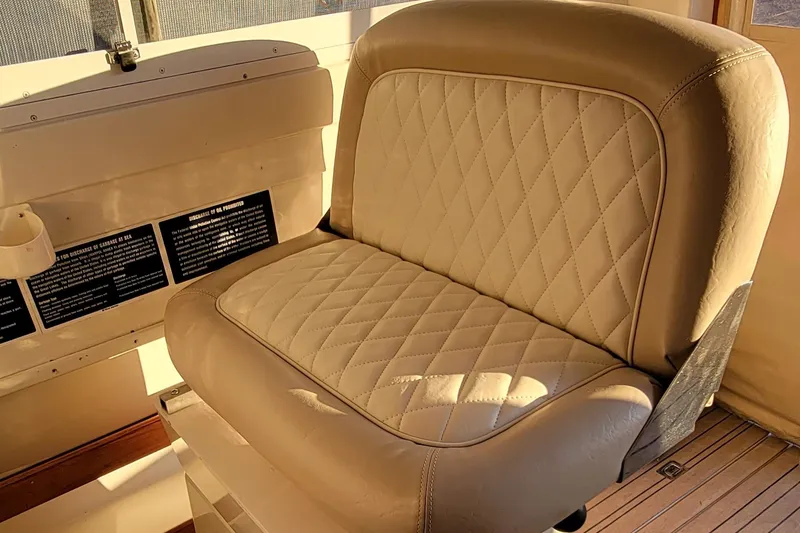 Slide: The Image of Luxurious leather seat on 2000 Hunt Yachts 28 Hardtop Express, featuring elegant diamond stitching. - 23
