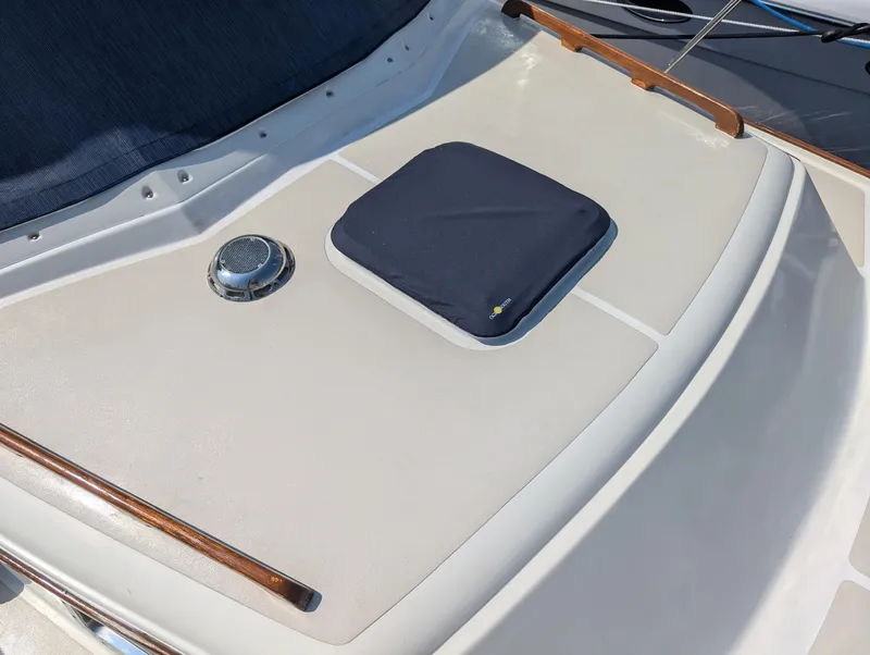 Slide: The Image of 2000 Hunt Yachts 28 Hardtop Express deck with hatch and wooden accents. - 35