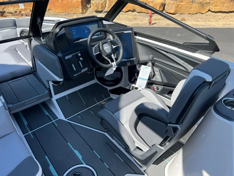 Slide: The Image of 2024 Supra SL boat interior with modern dashboard and steering wheel design. - 12