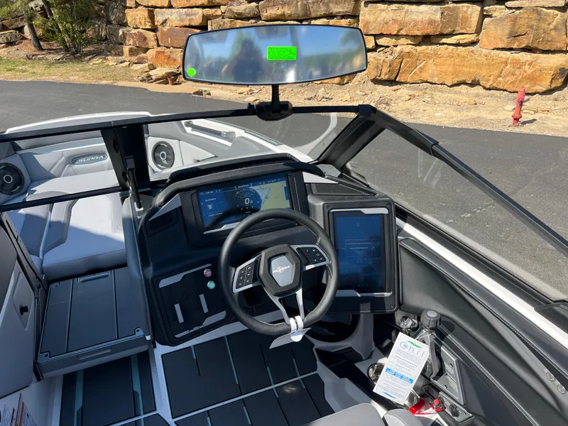 Slide: The Image of 2024 Supra SL boat interior with modern dashboard and steering wheel design. - 14