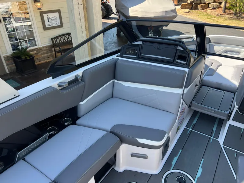 Slide: The Image of 2024 Supra SL boat interior with gray seating and modern dashboard design. - 15