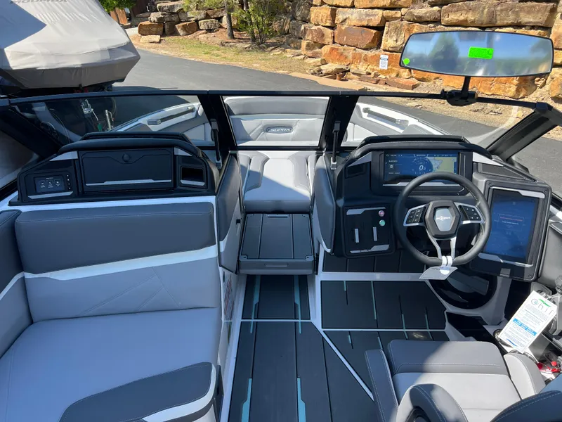Slide: The Image of 2024 Supra SL boat interior with modern dashboard and seating. - 18