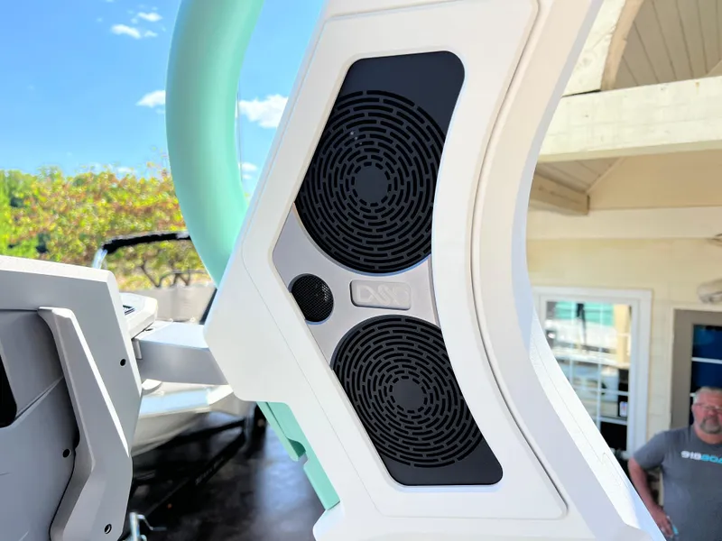 Slide: The Image of 2024 Supra SL boat speaker system with modern design and outdoor setting. - 19