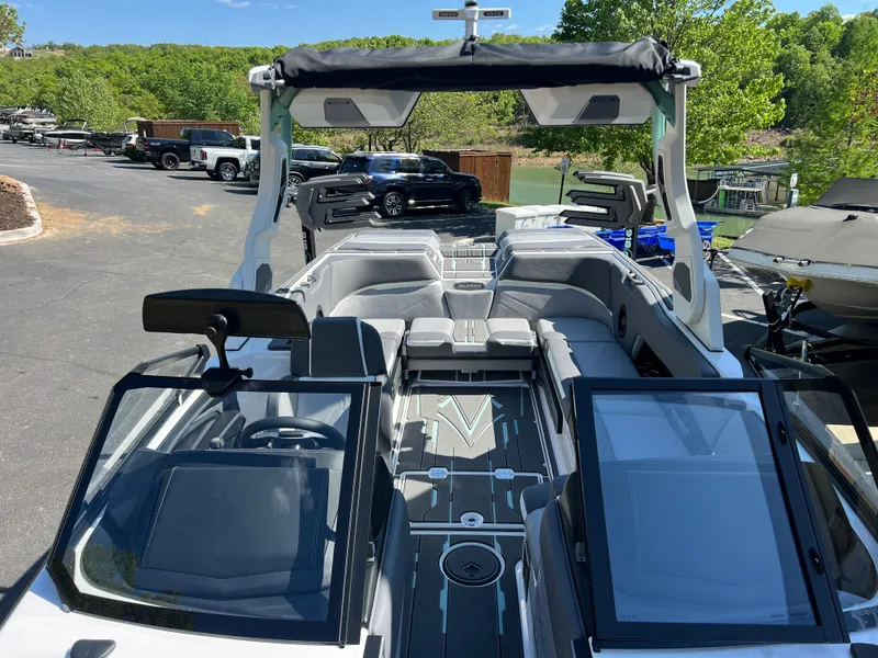 Slide: The Image of 2024 Supra SL boat interior with sleek seating and modern dashboard design. - 21