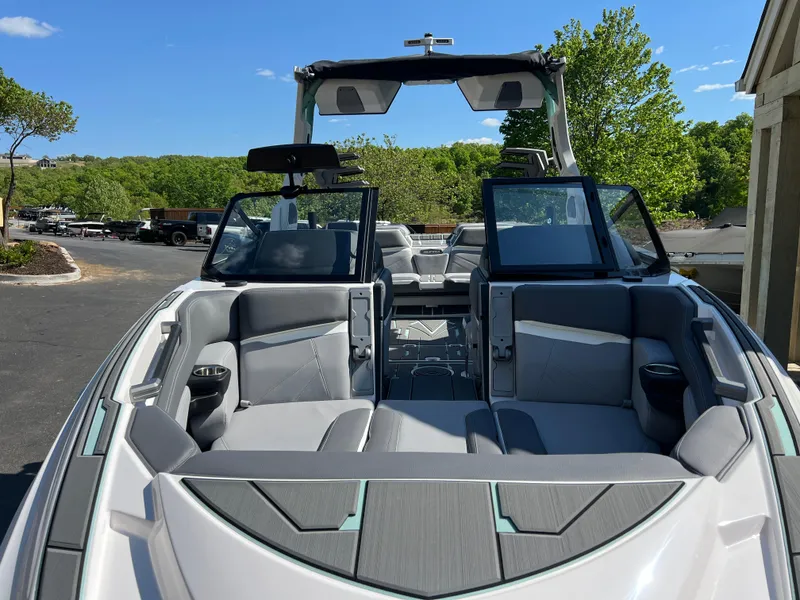 Slide: The Image of 2024 Supra SL boat with sleek interior design and open seating area. - 24