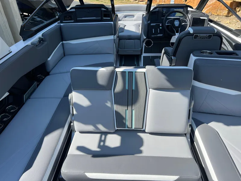 Slide: The Image of 2024 Supra SL boat interior with modern seating and steering console. - 28