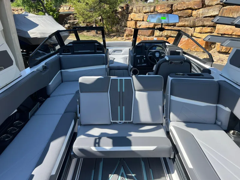 Slide: The Image of 2024 Supra SL boat interior with modern gray seating and sleek dashboard design. - 31