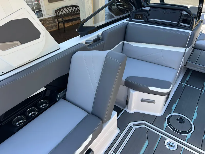 Slide: The Image of 2024 Supra SL boat interior with gray seating and modern dashboard design. - 32