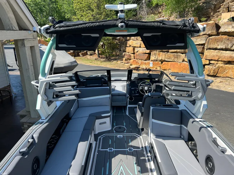 Slide: The Image of 2024 Supra SL boat interior with sleek seating and advanced dashboard features. - 9